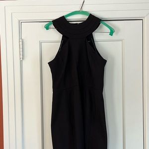 Cut away, fitted, black dress.